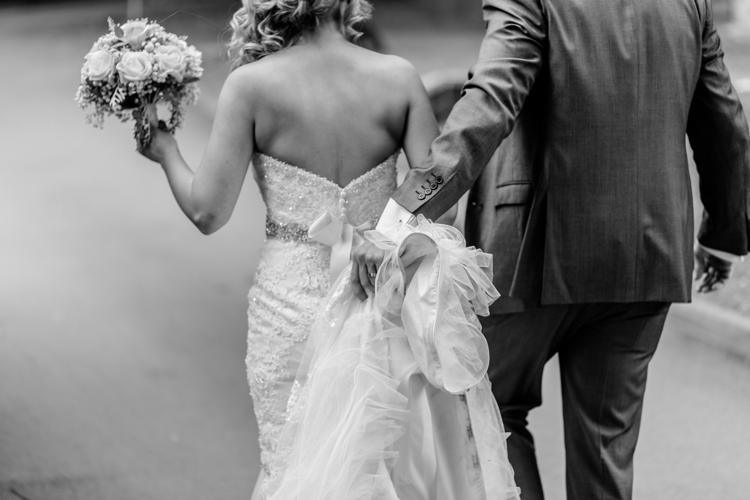 A newly married couple walking together